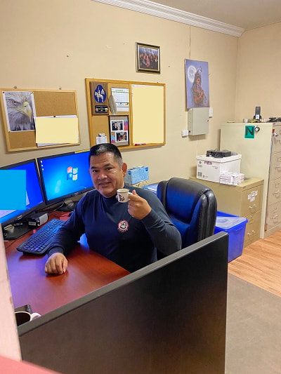 2020-mike-at-desk-with-coffee-resized_orig